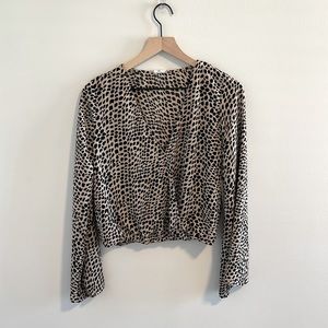 Cheetah print cropped blouse with flare sleeves!